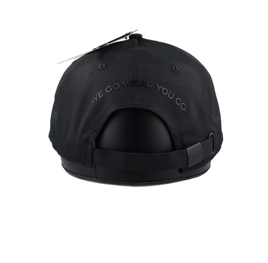 Close-up of black PU Zuri print on black baseball cap