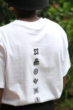 Model wearing white Zuri Nzuri cotton t-shirt