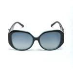 Black and turquoise polarized sunglasses with oversized round frames and gradient tinted lenses